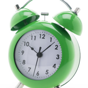 Green Classic Alarm clock isolated on white background